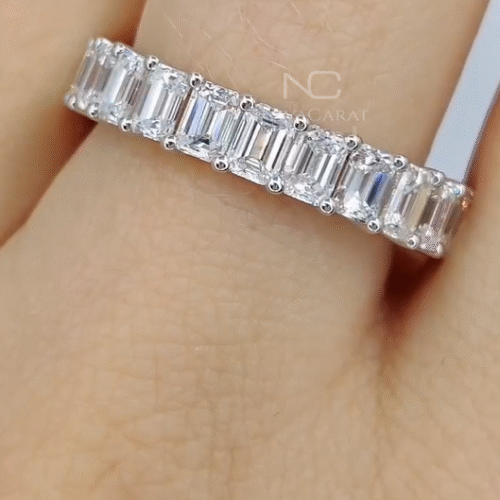 Studio lit shot of emerald cut eternity bridal diamond band, 14k white gold brilliance highlighting moissanite sparkle, luxury stacking wedding ring crafted as an anniversary gift. Emerald Cut Full Eternity Wedding Band, VVS Diamond Bridal Band, 14k White gold Band, Diamond Simulant band, Gift For Her, Anniversary Gift, Emerald cut moissanite full eternity wedding band in 14k white gold. VVS diamond bridal stacking ring, perfect anniversary or elegant gift for her, Emerald Moissanite, Diamond Ring