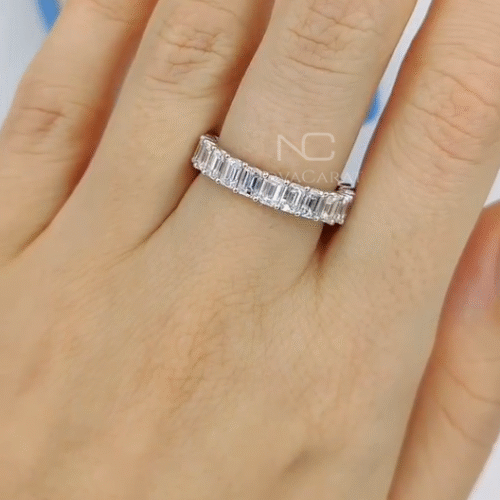 Left view of emerald cut full eternity diamond wedding band in 14k white gold, a sparkling VVS bridal band and stacking anniversary ring designed as timeless fine jewelry gift for her. Emerald Cut Lab Grown Diamond Eternity Ring, Moissanite Diamond Wedding Band, Emerald Cut Stackable Band, Anniversary Gifts for Her, Emerald Cut Diamond Wedding Band for Engagement Ring, Emerald Cut Moissanite Diamond Wedding Band Emerald Cut, Wedding Gifts Anniversary Ring For Women, Anniversary Gifts