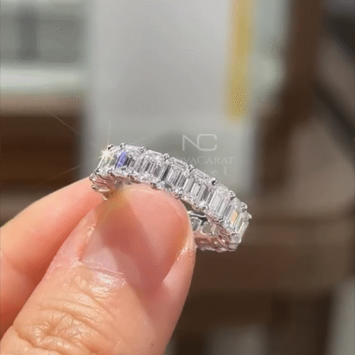 Left view of full eternity emerald cut moissanite diamond wedding band, white gold plated finish, certified handmade stacking ring, perfect bridal or anniversary gift for women. Diamond Eternity Ring, Diamond Wedding Band, Emerald Cut Diamond Wedding Ring, Emerald Cut Eternity Band, Full Eternity Emerald Cut Wedding Band, Genuine Moissanite Diamond Band, Vintage Anniversary Ring for Women, Handmade Jewelry, Emerald Cut Moissanite Diamond Eternity Ring, Full Eternity, Ring for Men or Women Left view of full eternity emerald cut moissanite diamond wedding band, white gold plated finish, certified handmade stacking ring, perfect bridal or anniversary gift for women. Diamond Eternity Ring, Diamond Wedding Band, Emerald Cut Diamond Wedding Ring, Emerald Cut Eternity Band, Full Eternity Emerald Cut Wedding Band, Genuine Moissanite Diamond Band, Vintage Anniversary Ring for Women, Handmade Jewelry, Emerald Cut Moissanite Diamond Eternity Ring, Full Eternity, Ring for Men or Women